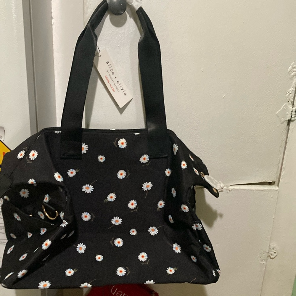 Alice + Olivia dufffel bag, black with flowers.
